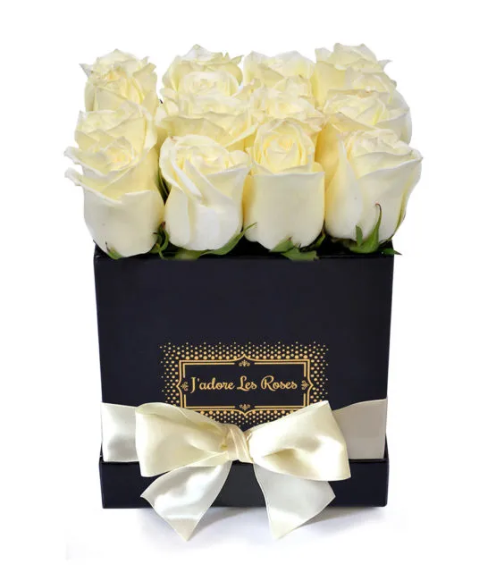 white roses in black small box