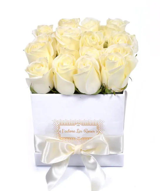 white roses in white small square box