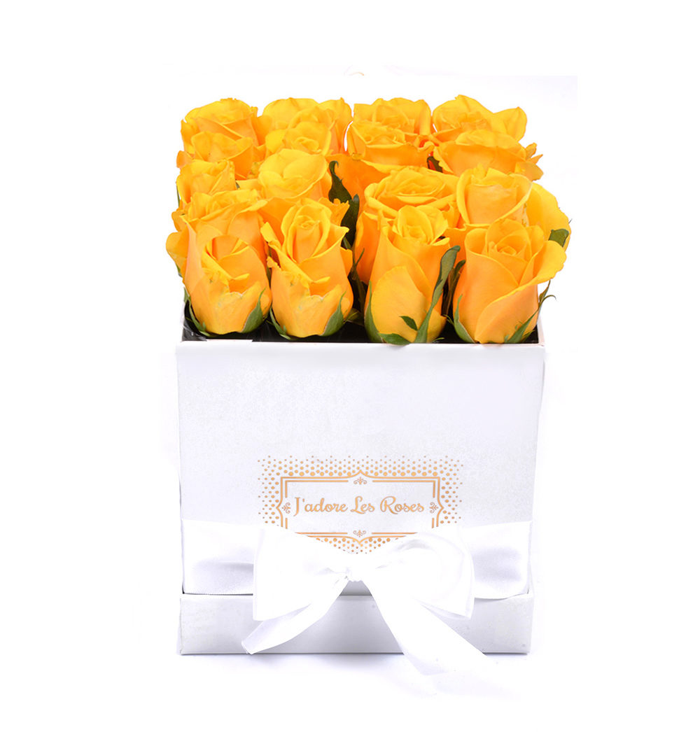 yellow roses in white square box