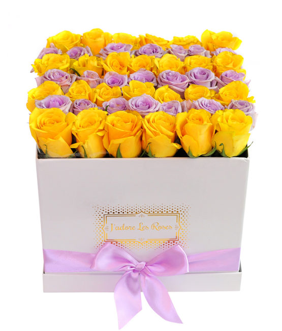 yellow and purple roses in white medium box